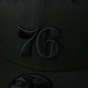 A close up of the logo on the Philadelphia 76ers New Era Tonal 9Fifty Snapback