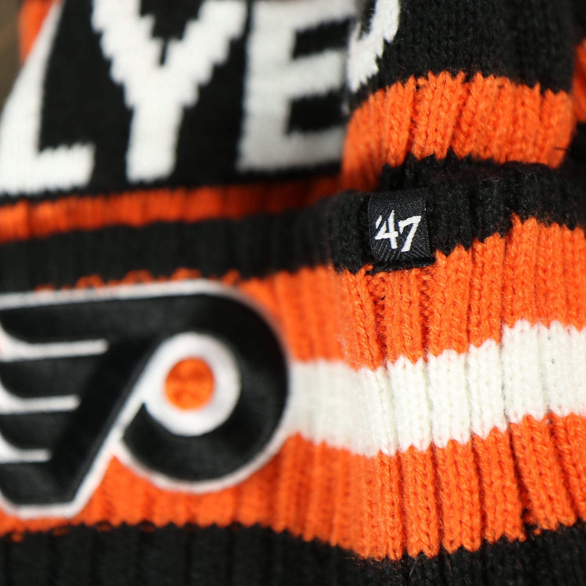 47 brand logo on the cuff of the Philadelphia Flyers Two Sided Cuffed Winter Beanie | Orange, White, And Black Winter Beanie