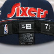 Labels on the interior of the Philadelphia 76ers 2022 City Edition Sixers Script Spectrum Side Patch Navy 59Fifty Fitted Cap