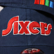 Sixers wordmark on the front of the Philadelphia 76ers 2022 City Edition Sixers Script Spectrum Side Patch 9Twenty Dad Hat