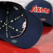 Navy blue under visor on the Philadelphia 76ers 2022 City Edition Sixers Script Spectrum Side Patch 9Twenty Dad Hat