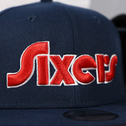 Close up of the Sixers wordmark script on the Philadelphia 76ers 2022 City Edition Sixers Script Spectrum Side Patch 9Fifty Snapback Hat