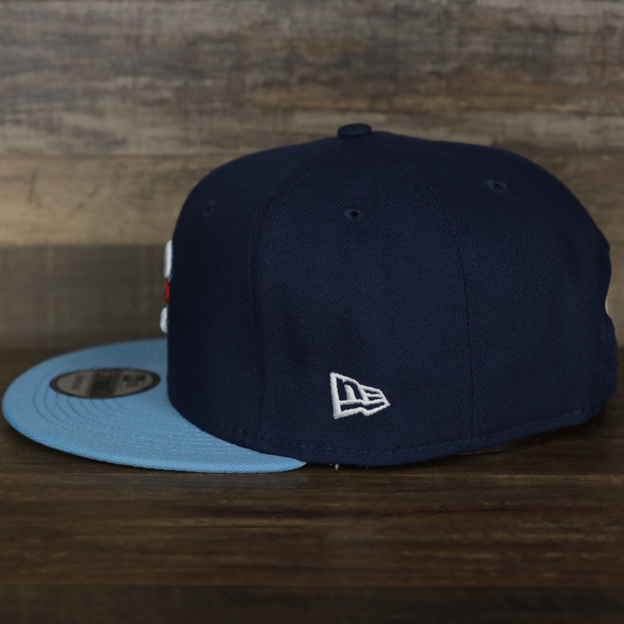 wearers left side of the Chicago Cubs MLB City Connect 2021 On-Field 9Fifty Blue Bottom Snapback | Navy Blue