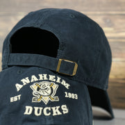back side of the Anaheim Ducks Throwback Distressed Black Dad Hat | Black Adjustable Baseball Cap
