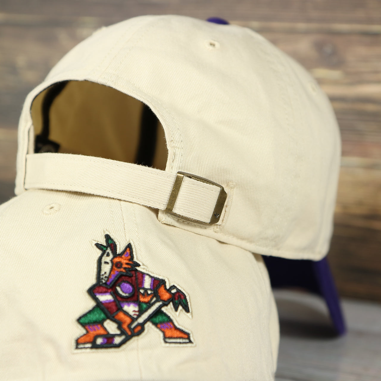 back side of the Arizona Coyotes Throwback Distressed White Dad Hat | White Adjustable Baseball Cap