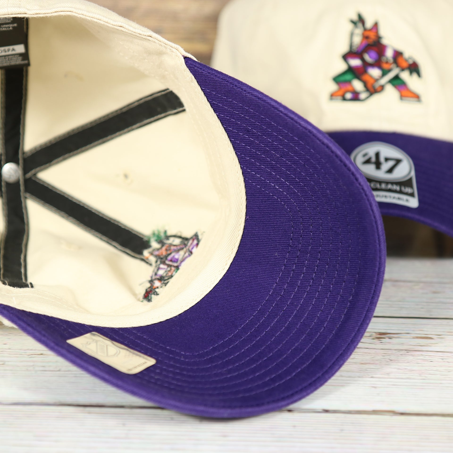 underside of the Arizona Coyotes Throwback Distressed White Dad Hat | White Adjustable Baseball Cap