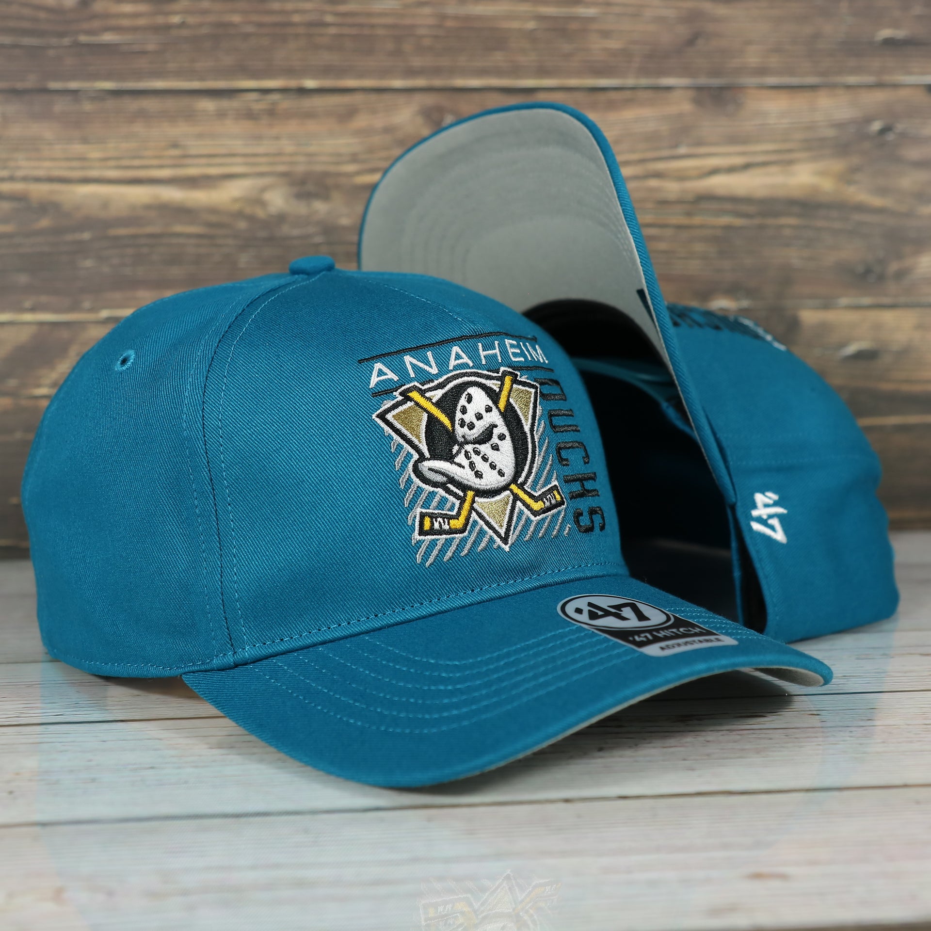 front and bottom of the Anaheim Ducks Throwback Blue Snapback Dad Hat | Blue Adjustable Baseball Cap