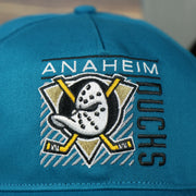 logo on the front of the Anaheim Ducks Throwback Blue Snapback Dad Hat | Blue Adjustable Baseball Cap