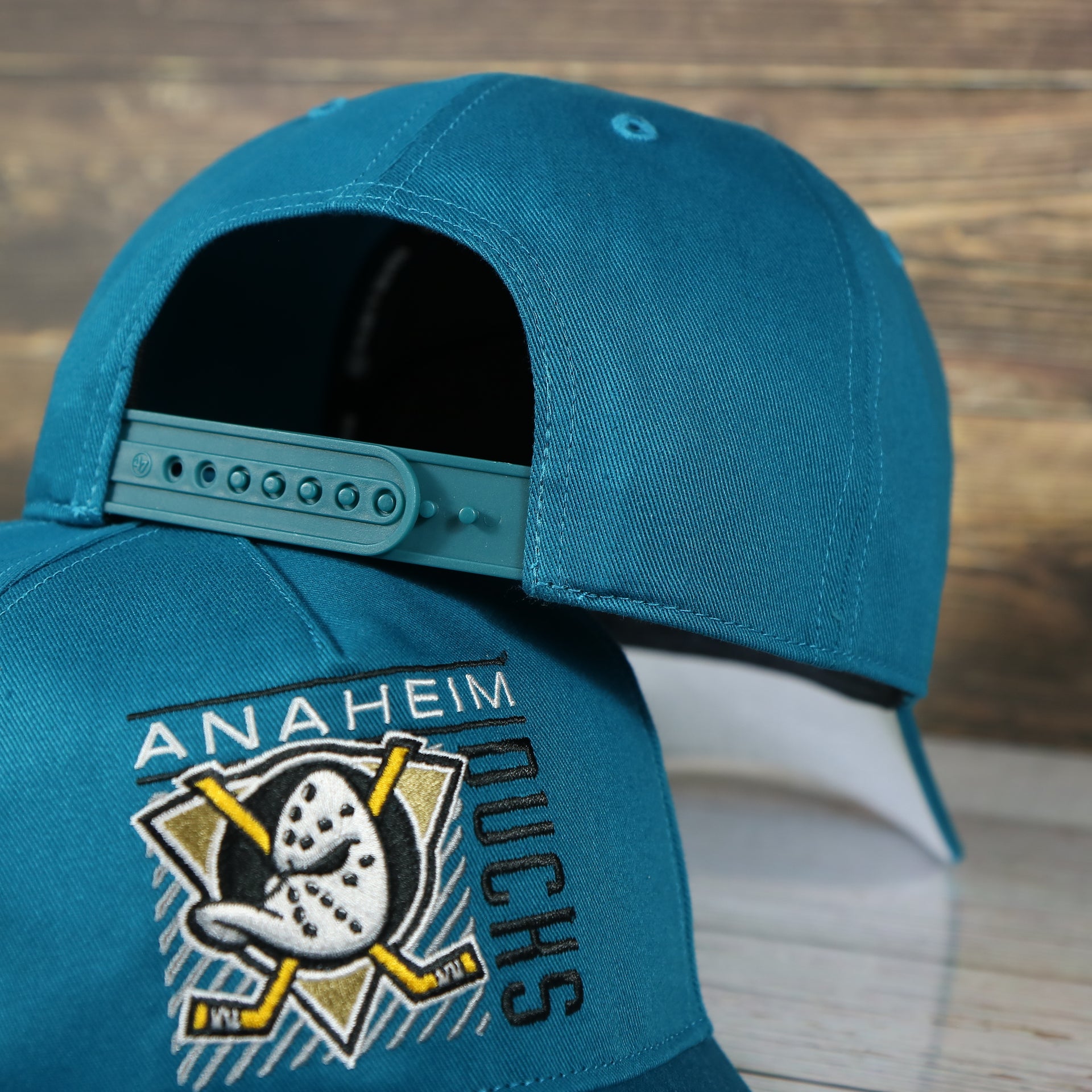 backside of the Anaheim Ducks Throwback Blue Snapback Dad Hat | Blue Adjustable Baseball Cap