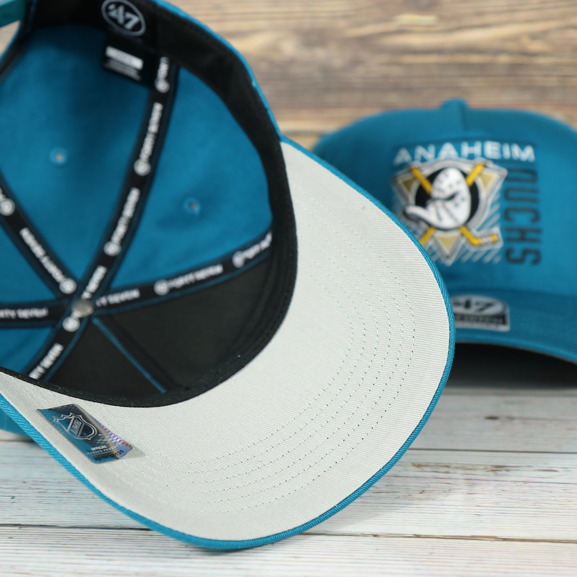 underside of the Anaheim Ducks Throwback Blue Snapback Dad Hat | Blue Adjustable Baseball Cap