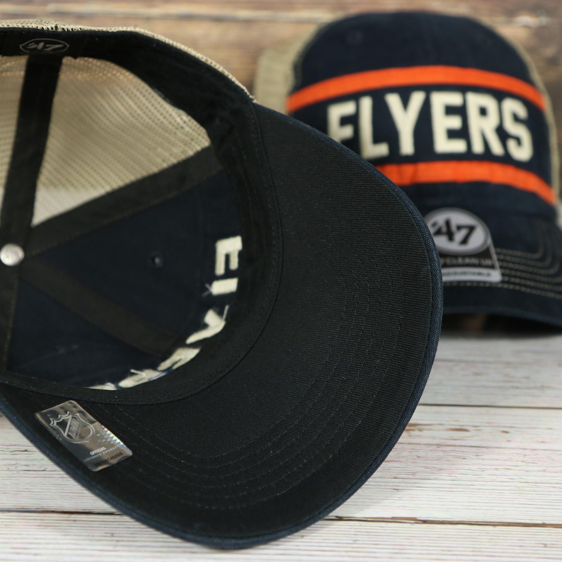 under side of the Philadelphia Flyers Vintage Meshback Orange/Black Trucker Snapback Hat