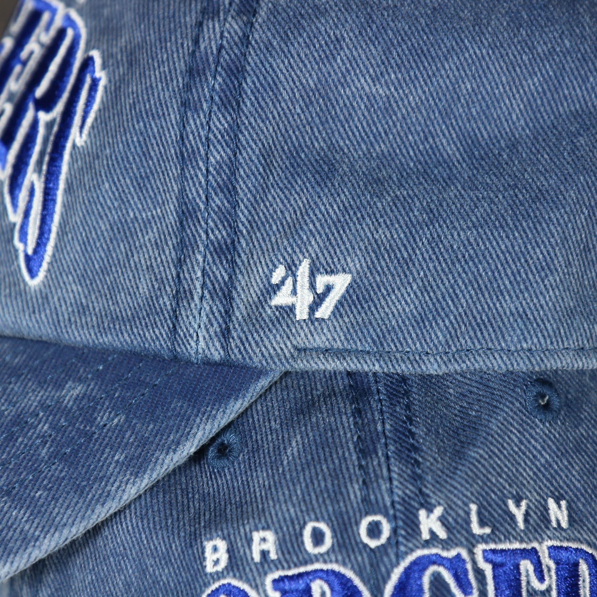 47 brand logo on the Brooklyn Dodgers Throwback Distressed Blue Dad Hat | Blue Adjustable Baseball Cap
