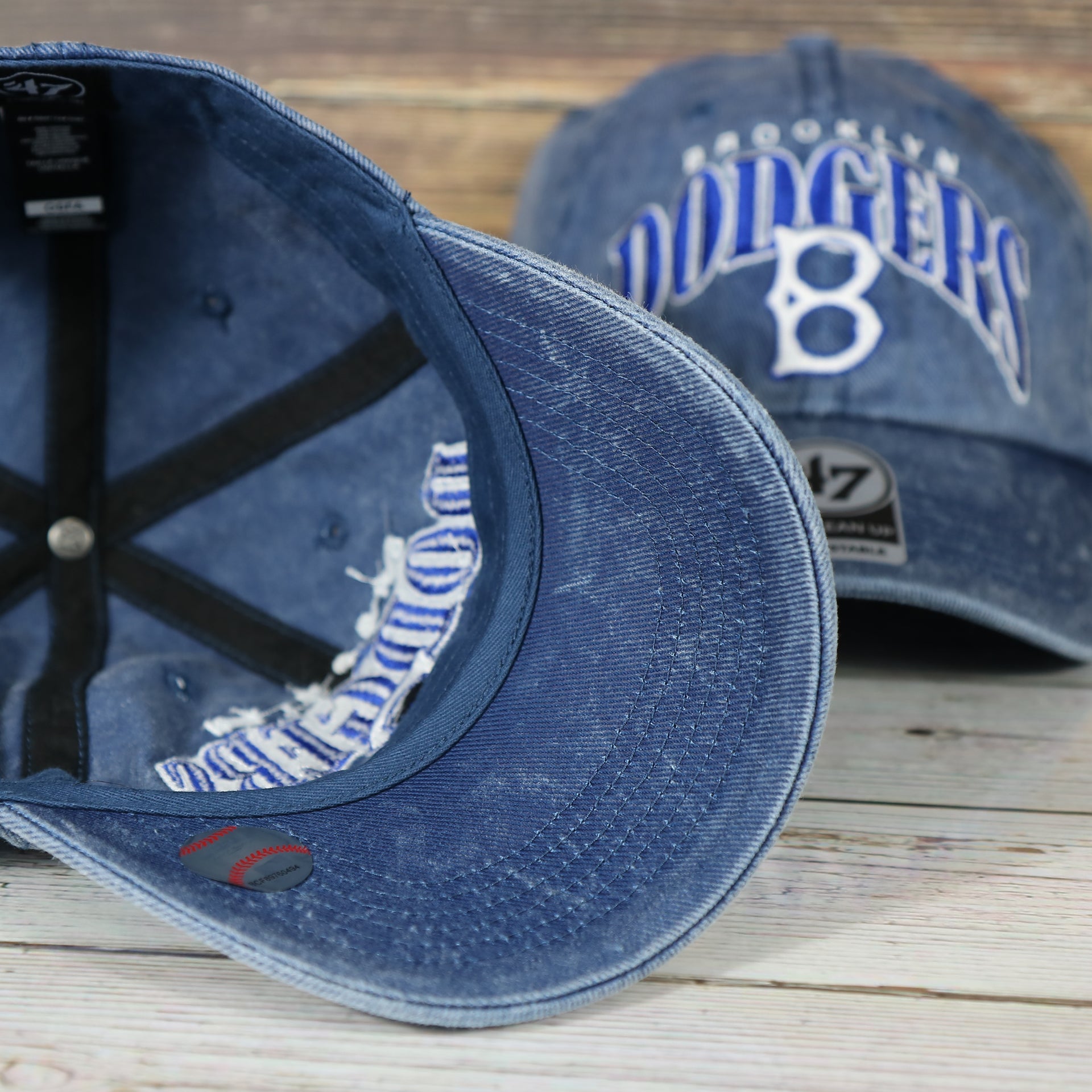 underside of the Brooklyn Dodgers Throwback Distressed Blue Dad Hat | Blue Adjustable Baseball Cap