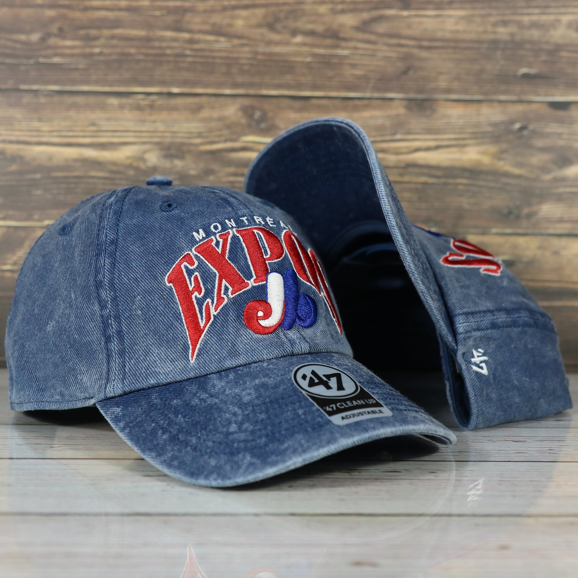 front side of the Montreal Expos Throwback Distressed Blue Dad Hat | Blue Adjustable Baseball Cap
