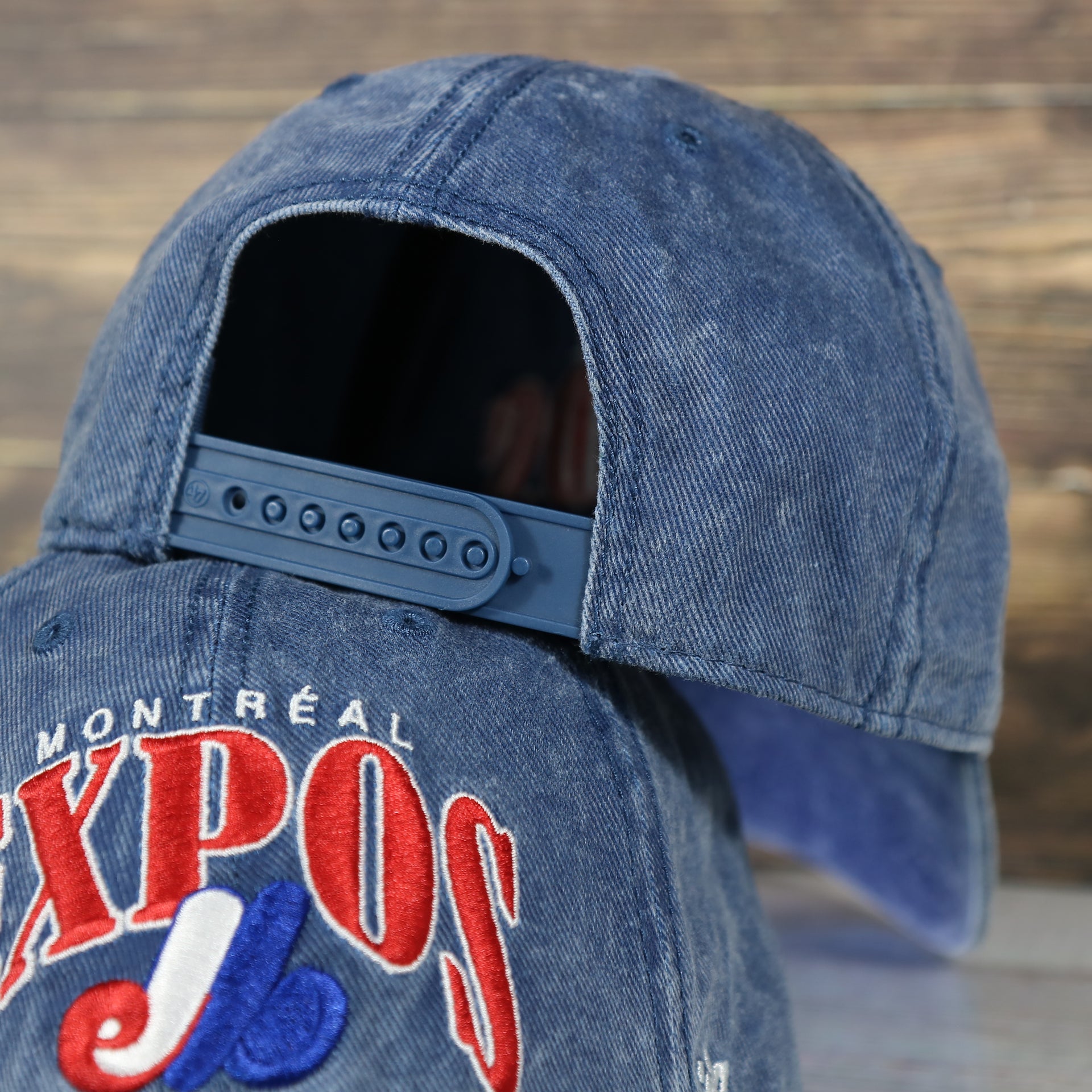 backside of the Montreal Expos Throwback Distressed Blue Dad Hat | Blue Adjustable Baseball Cap
