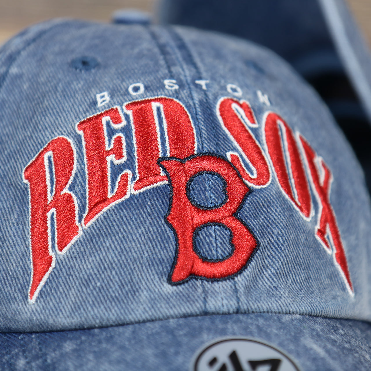 front logo on the Boston Red Sox Throwback Distressed Blue Dad Hat | Blue Adjustable Baseball Cap