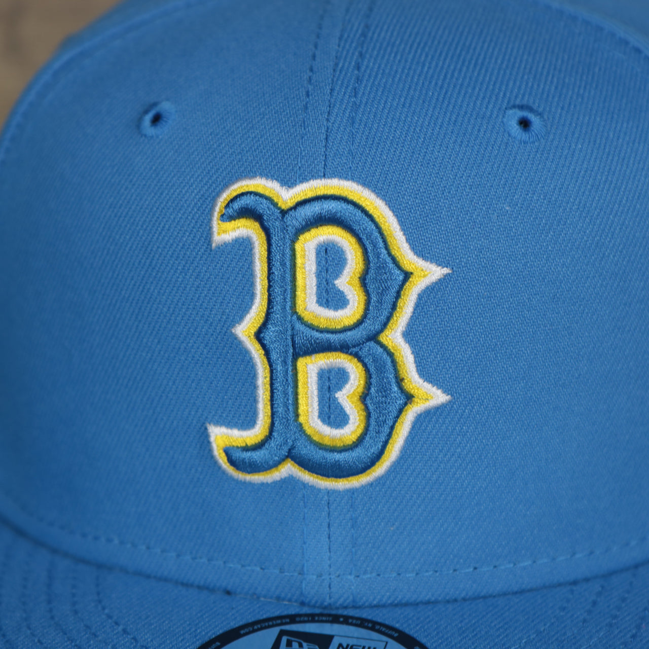 A close up of the logo on the Boston Red Sox MLB City Connect 2021 On-Field Side Patch 9Fifty Snapback