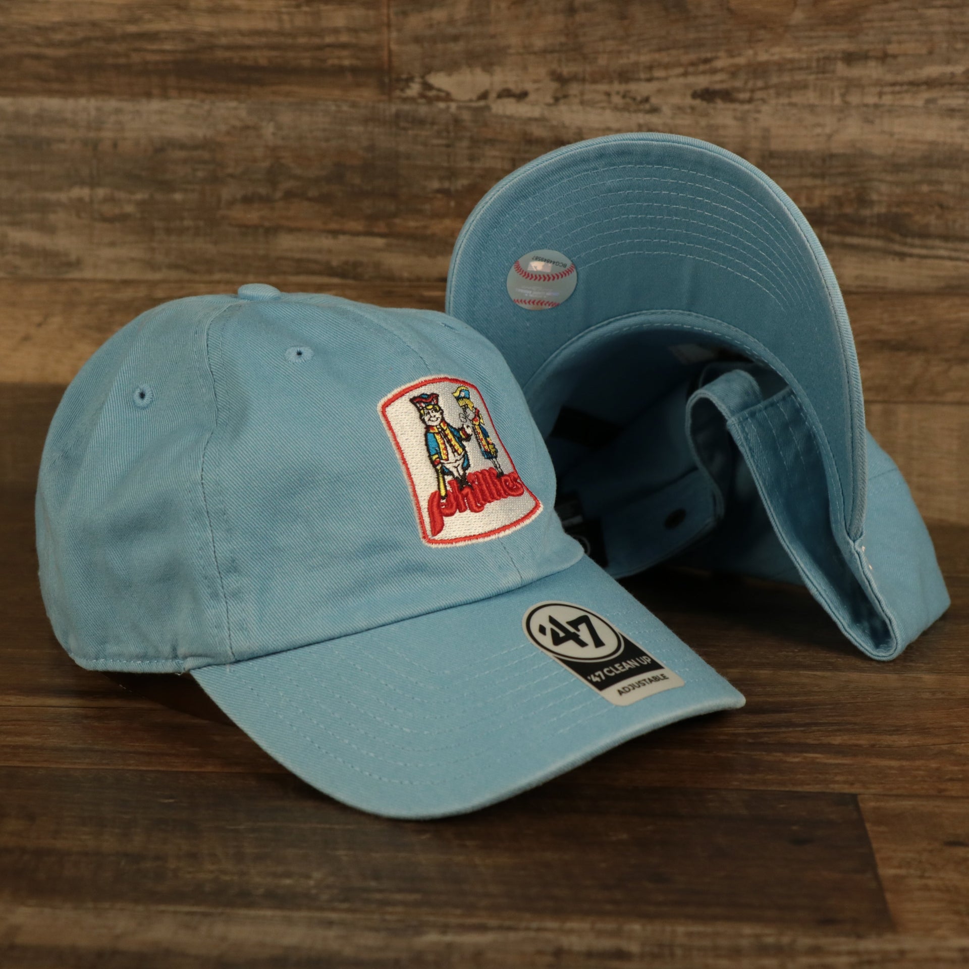 front and bottom of the Philadelphia Phillies 1970 Quaker Logo Powder Blue Adjustable Dad Hat