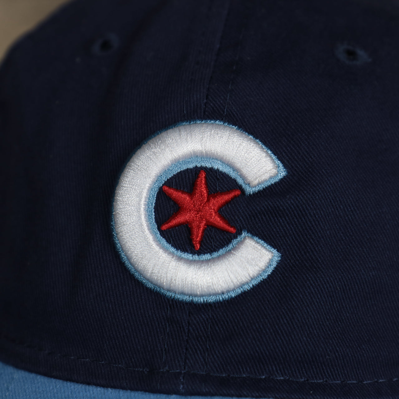 A close up of the logo on the Chicago Cubs MLB City Connect 2021 On-Field 9Twenty Dad Hat