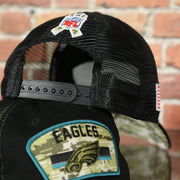 black adjustable snap on the Philadelphia Eagles 2021 Salute To Service On Field Sideline 9Twenty Trucker Dad Hat