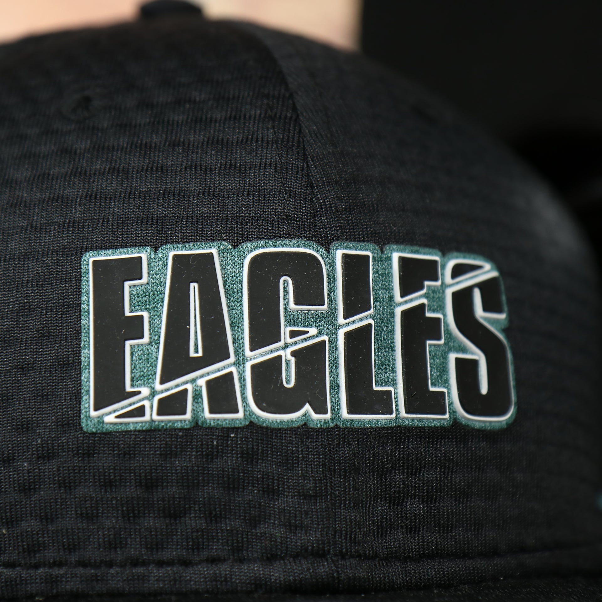 eagles logo on the front of the Philadelphia Eagles 2020 NFL Training Camp 9Fifty Black Bottom On-Field Snapback | Black OSFM