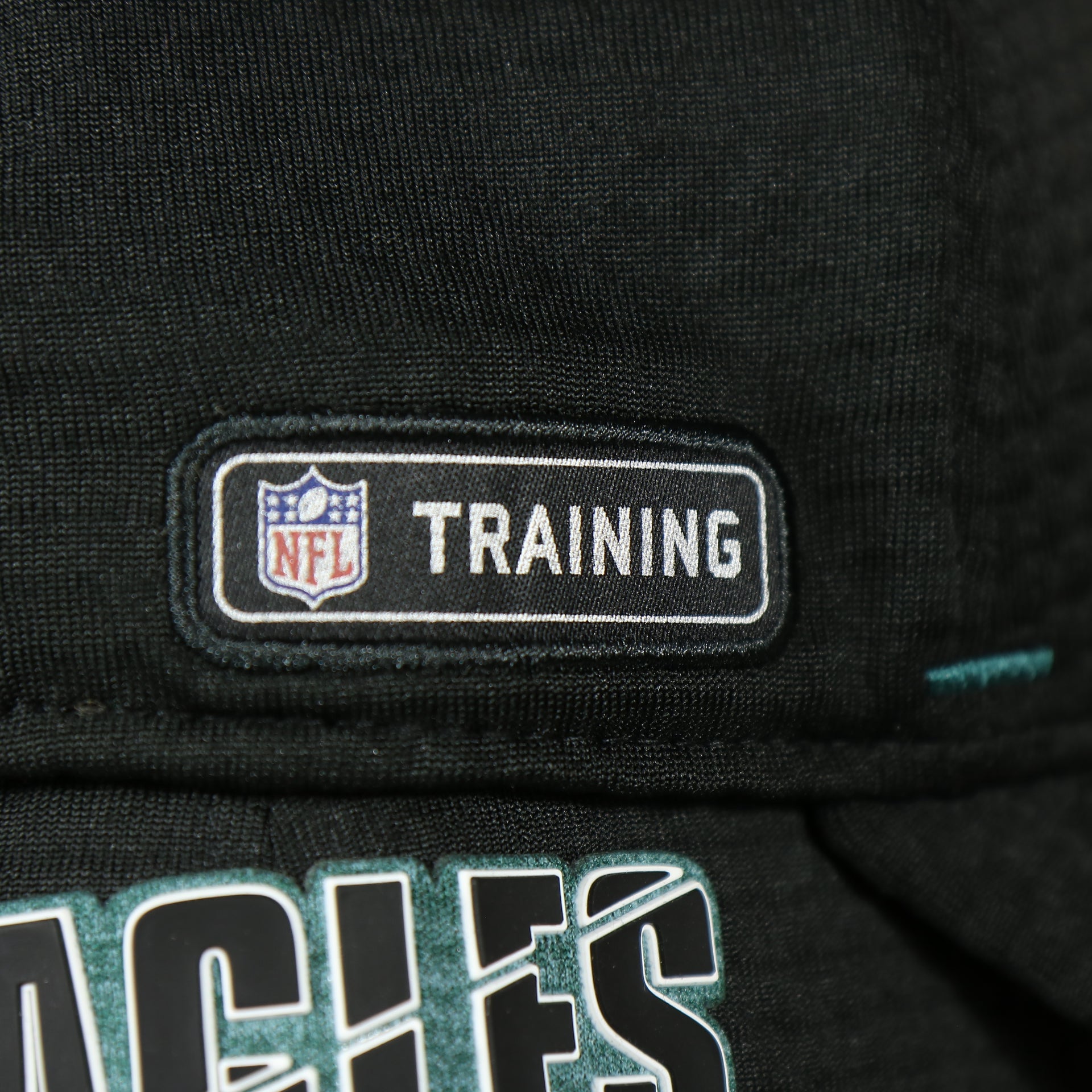 NFL training patch on the Eagles 2020 Training Camp Flexfit | Philadelphia Eagles 2020 On-Field Black Training Camp Stretch Fit