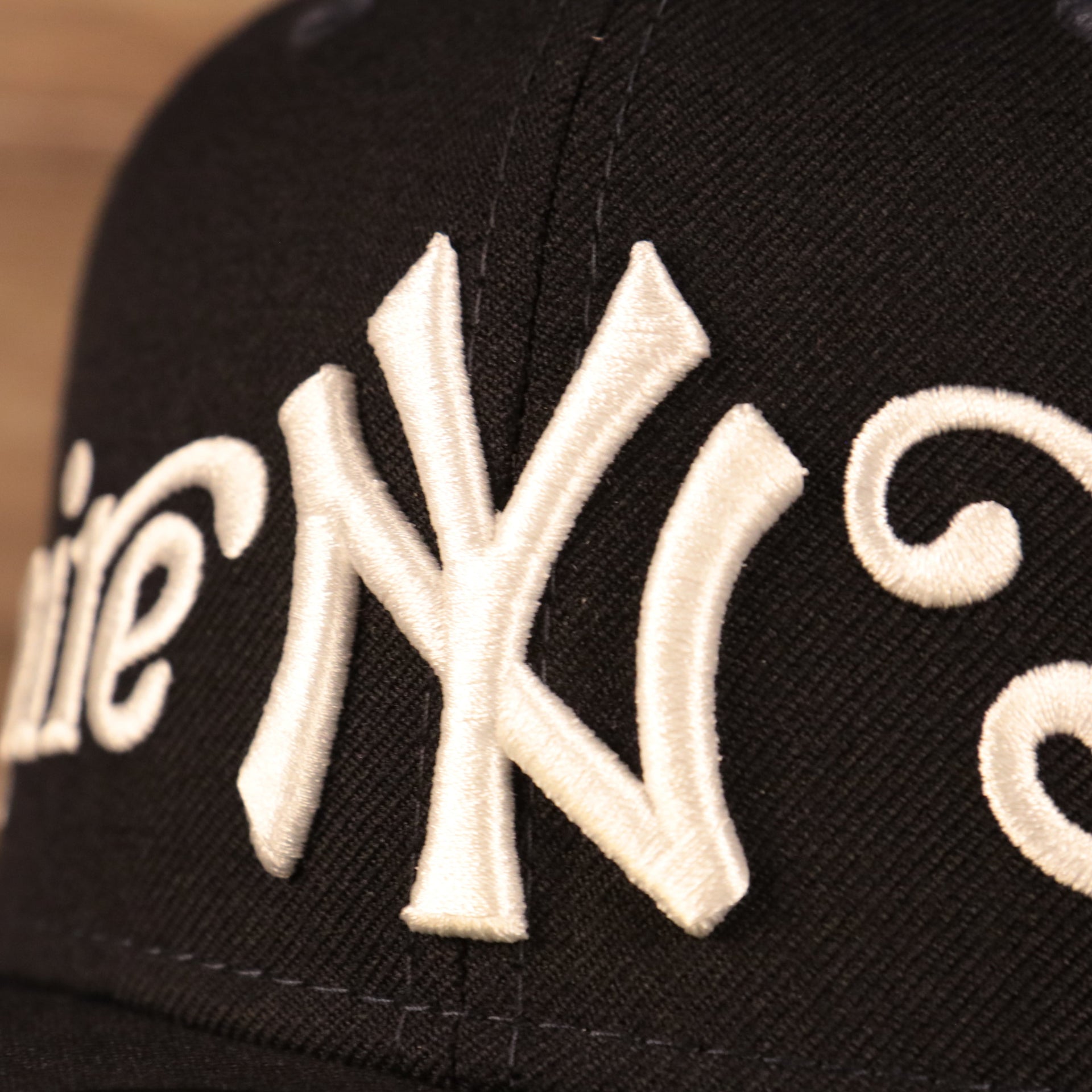Close up of the Yankees logo on the New York Yankees Empire State Script Nickname Gray Bottom 59Fifty Fitted Cap