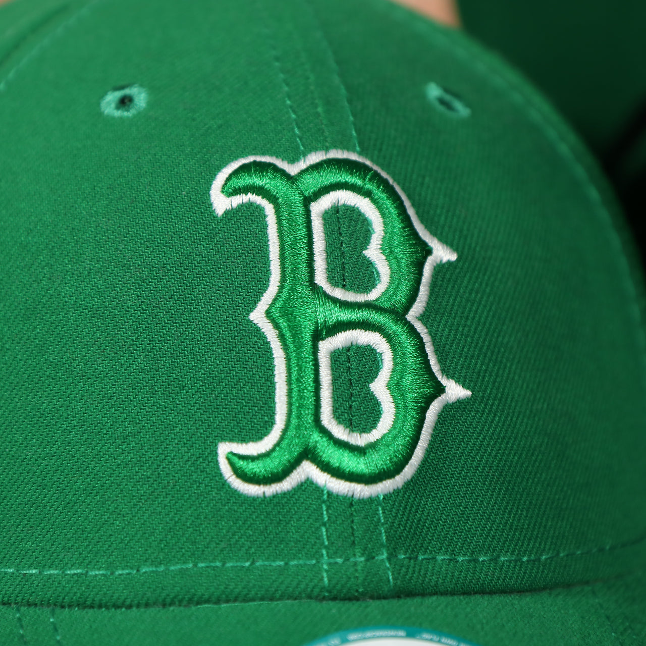 red sox logo on the front of the Boston Red Sox ST. Patrick's Dad  Logo Green Bottom Dad Hat | Green Dad Hat