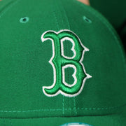 red sox logo on the front of the Boston Red Sox ST. Patrick's Dad  Logo Green Bottom Dad Hat | Green Dad Hat