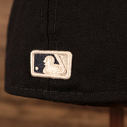 Close up of the MLB Batterman logo on the New York Yankees Empire State Script Nickname Gray Bottom 59Fifty Fitted Cap