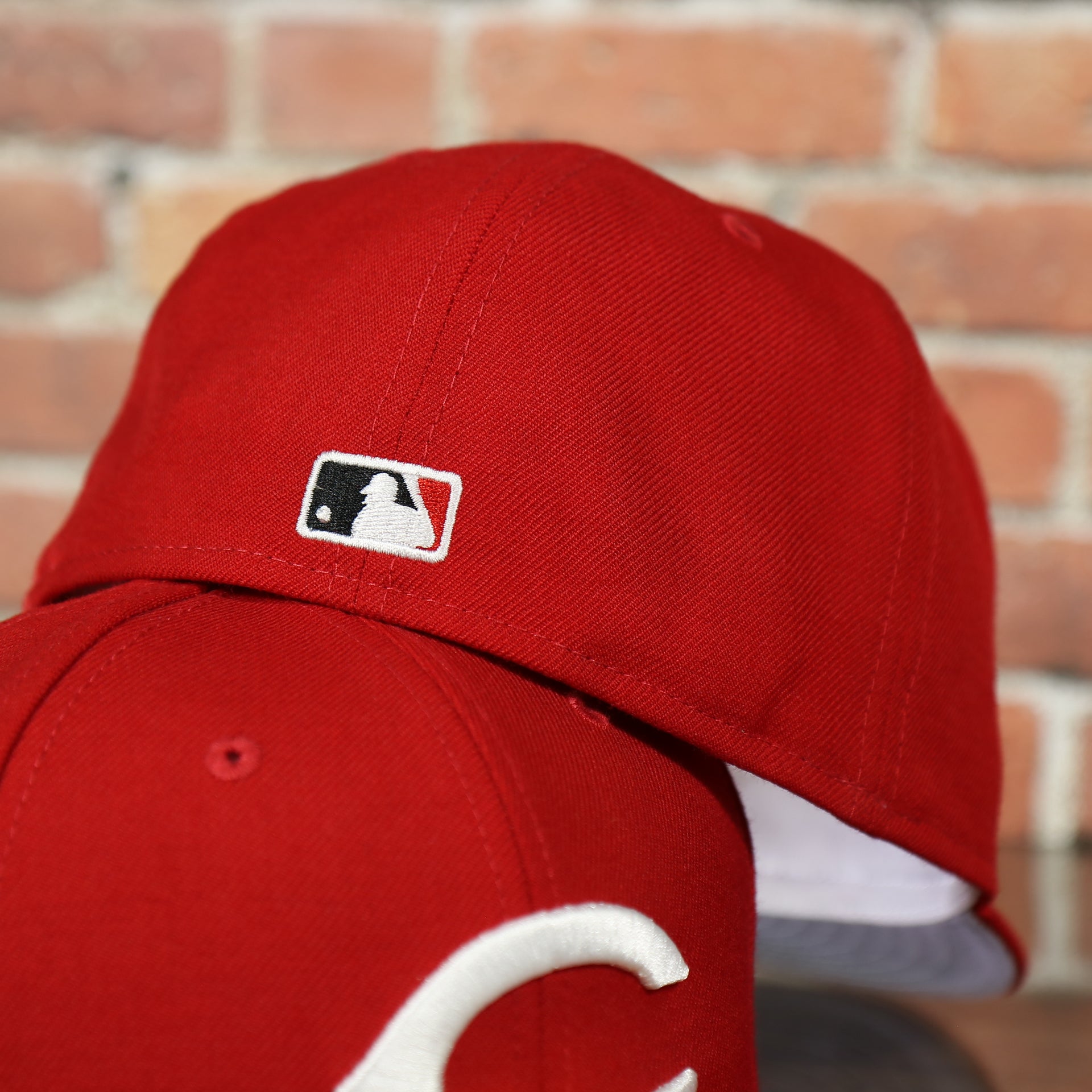 MLB cooperstown logo on the Reds On-Field Grey Bottom Fitted Cap | Cincinnati Reds 1990 Game Worn World Series Side Patch Gray Under Brim 59Fifty Fitted Hat