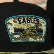eagles logo on the Philadelphia Eagles 2021 Salute To Service On Field Sideline 59Fifty Fitted Cap