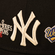 Close up of the New York Yankees logo on the front of the New York Yankees 1996 World Series Script Patch Gray Bottom 59Fifty Fitted Cap