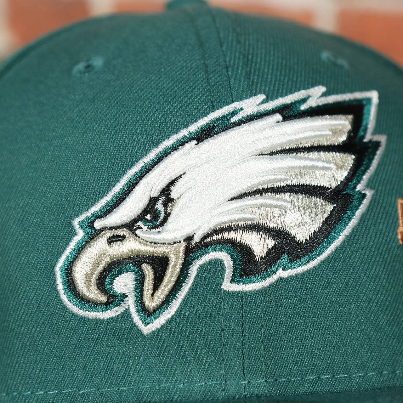 eagles logo on the Philadelphia Eagles City Transit All Over Side Patch Gray Bottom 59Fifty Fitted Cap