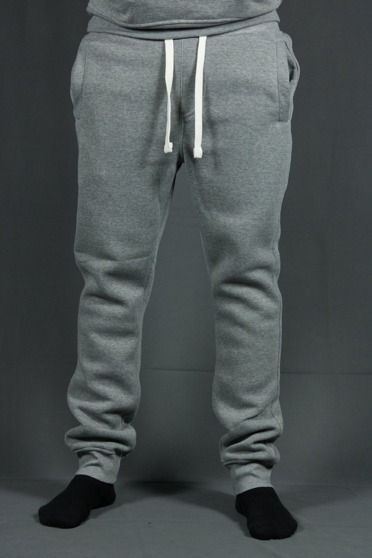 These suede fleece heather grey joggers are solid heather grey with two front pockets