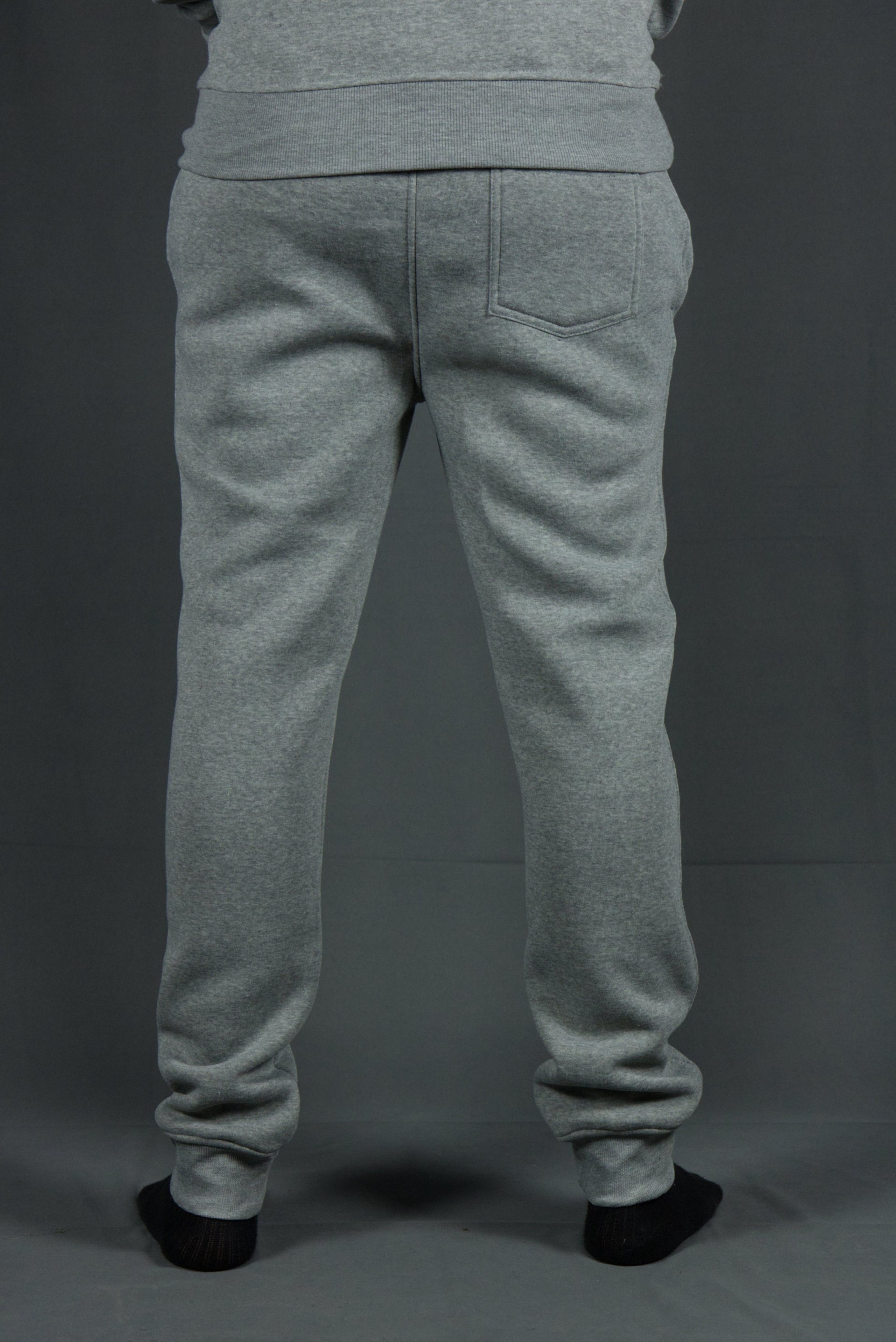 On the wearer's back right of the suede fleece heather grey joggers is a roomy back pocket