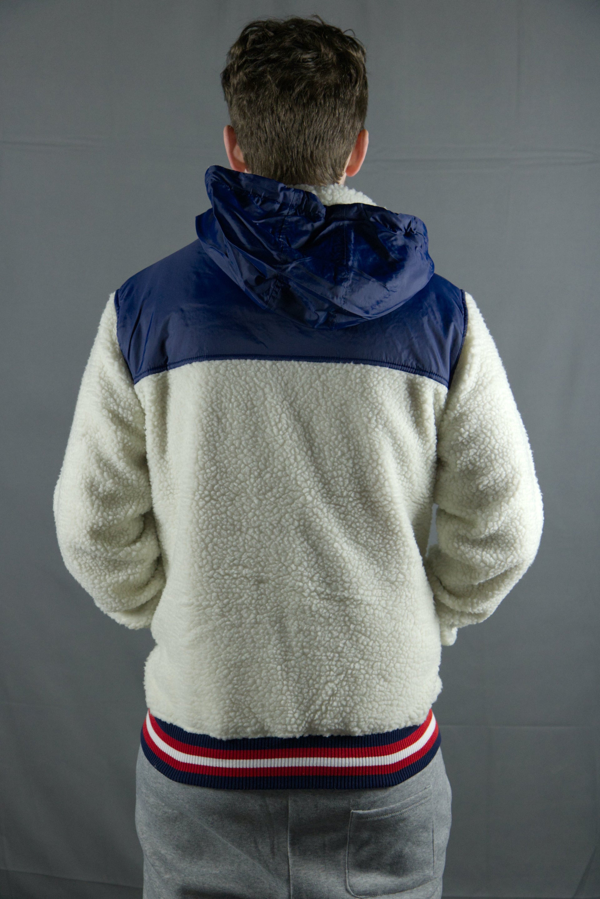 The sherpa material on the cream zipper sherpa hoodie is cream coloed