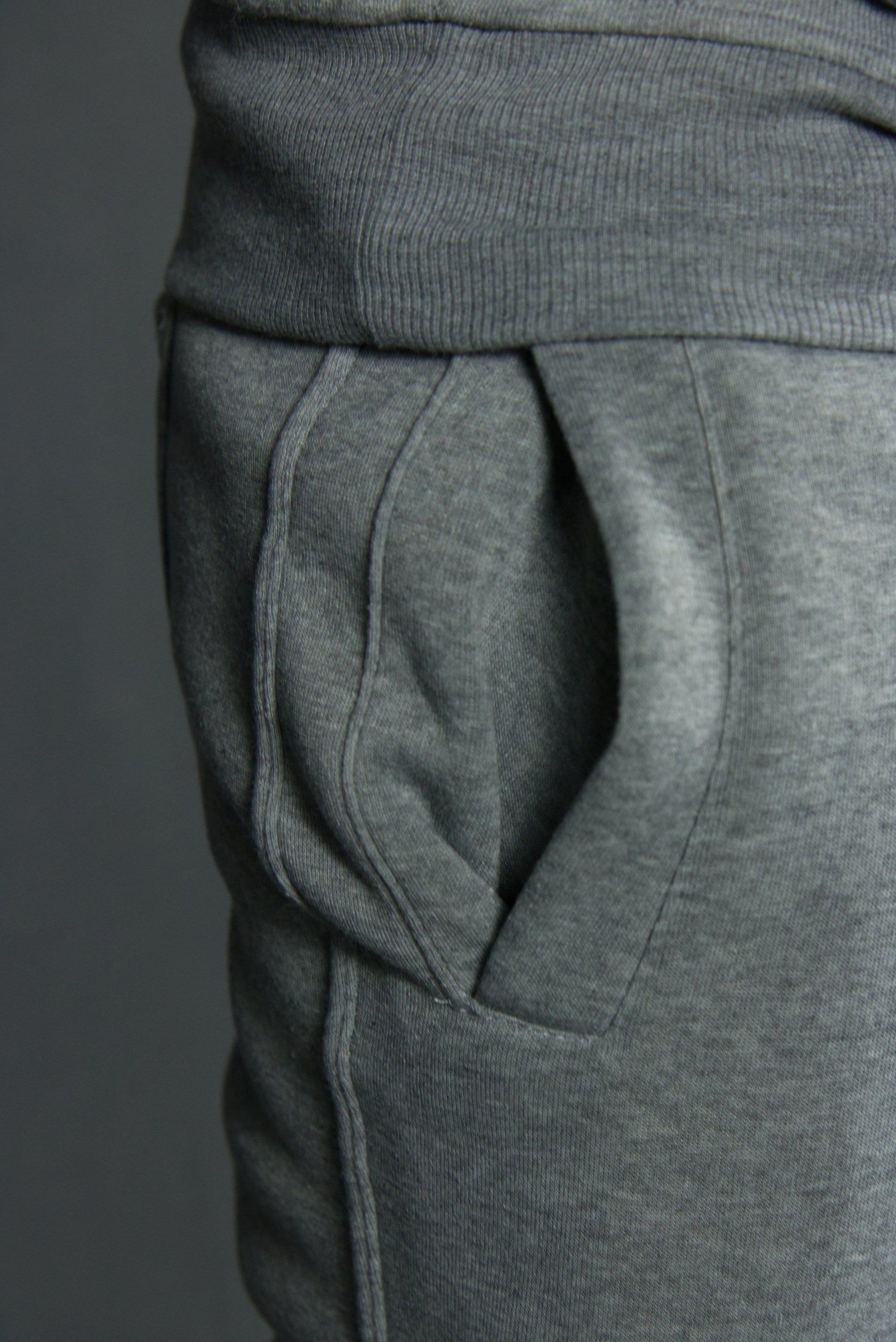 The side of the suede fleece heather gray tapered track sweatpants had a hem running down the length of the leg
