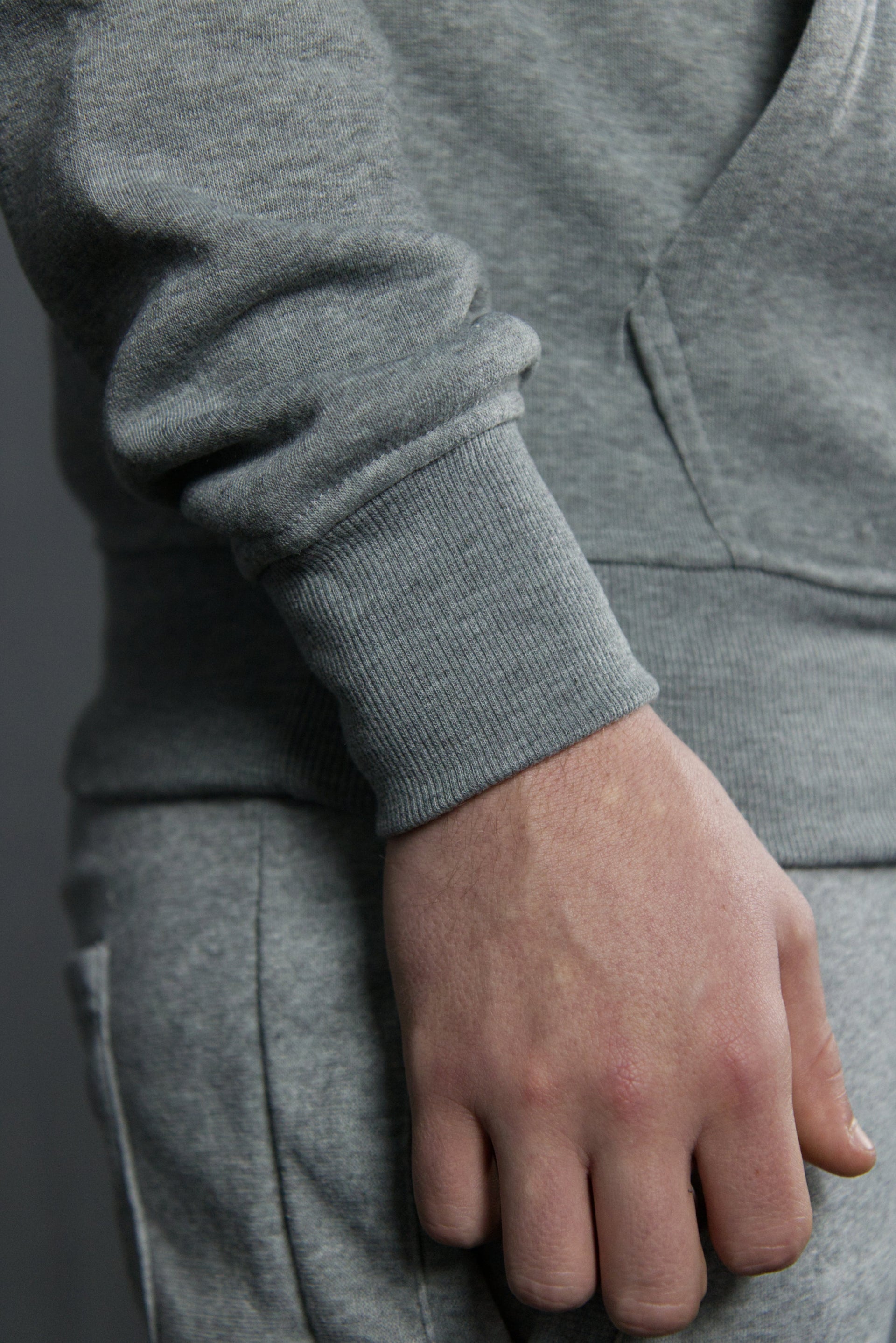 The sleeves of the classic fleece men's pullover hoodie are tapered and fit snug around the wearer's wrist for maximum maneuverability and comfort