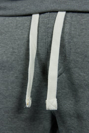 The white adjustable draw strings on the suede fleece heather grey joggers are solid white with texture and square tips