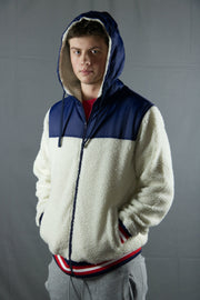 Stay warm thanks to the sherpa exterior and interior on this cream and navy blue zip up sherpa hoodie