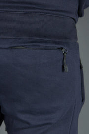 The back zipped pocket of the navy joggers by Jordan Craig.