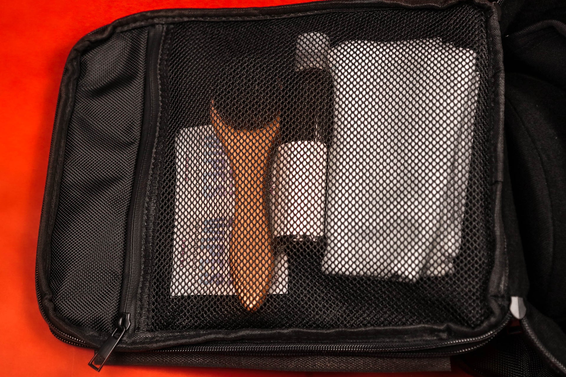 The mesh pocket on the Black Box Media Camera Travel Bag / Cap Carrier with Custom Dividers and Glasses Case