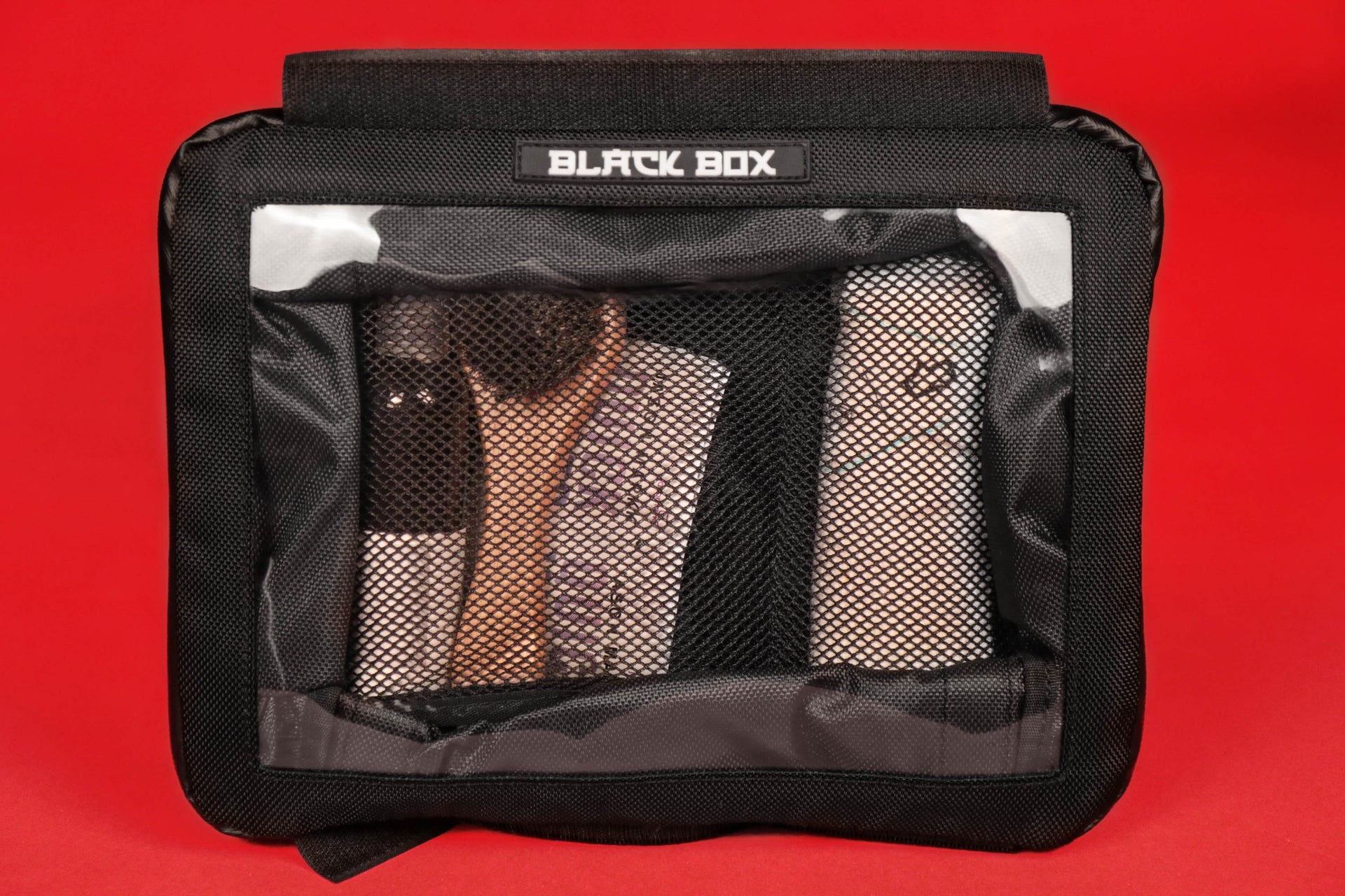 The Black Box Portable Hanging Sneaker Bag For Travel and Storage With Clear Window filled with sneaker cleaning items