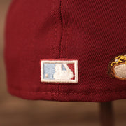 A close up shot of the NBA logo patch on the backside of the maroon Phillies 1980 World Series gray bottom brim 59fifty fitted hat by New Era.