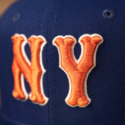 The old english NY Mets logo on the vintage blue underbrim fitted 59fifty by New Era.
