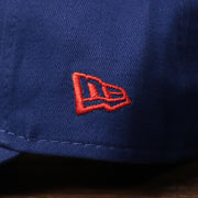 The left side of the Philadelphia 76ers royal blue baby ball cap has the logo of New Era.