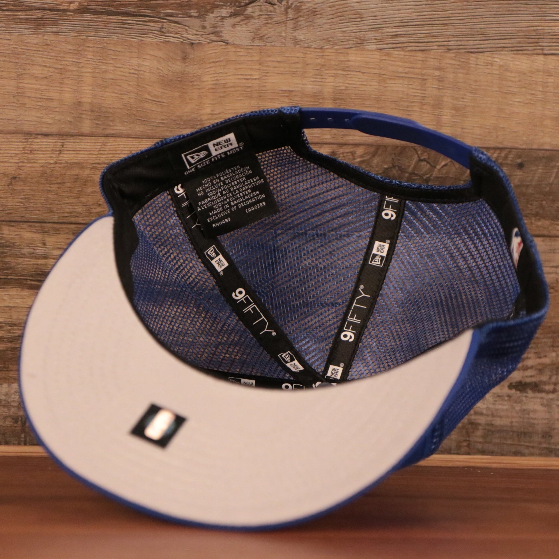 An inside look of the royal blue mesh 9fifty snapback hat by New Era.