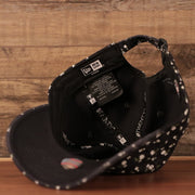 The inside look of the Yankees navy blue women's floral dad hat by New Era.