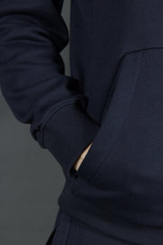 The spacious pocket of the Jordan Craig navy blue basic tech fleece pullover hoodie.